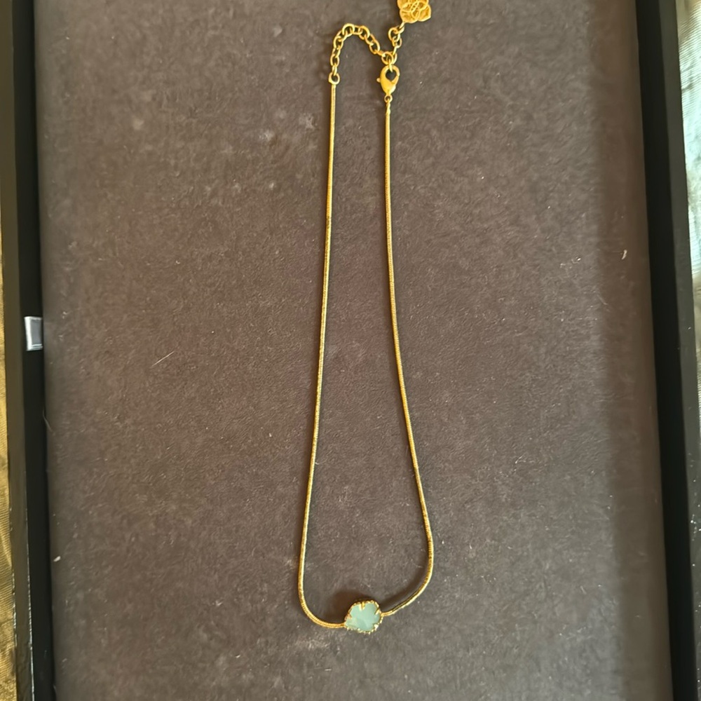 Kendra Scott gold necklace with mint color stone